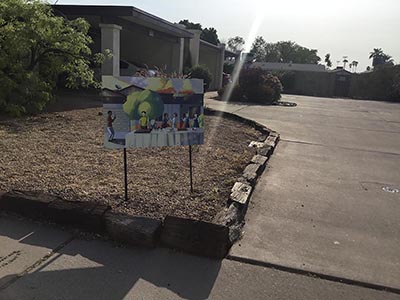 Exterior of home, with potluck sign