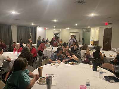 people at potluck dinner