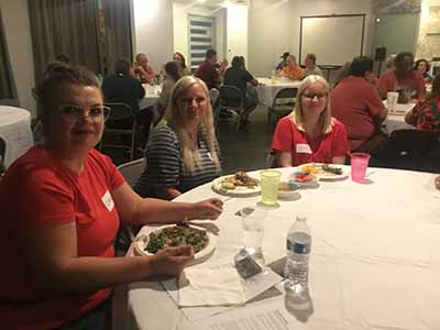 people at potluck dinner