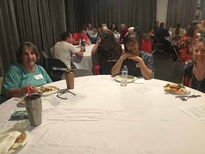 people at potluck dinner