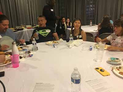 people at potluck dinner