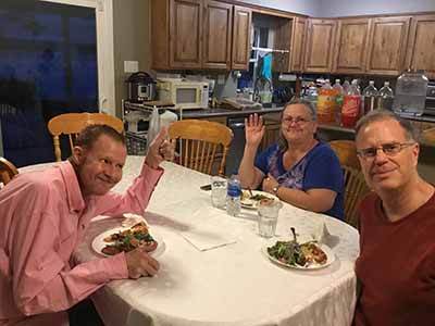 people sitting at dining room table