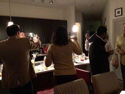 people toasting the new year at New Years Eve party