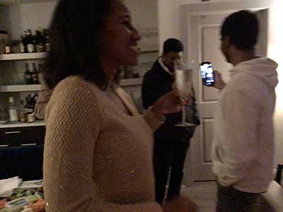 people toasting the new year at New Years Eve party