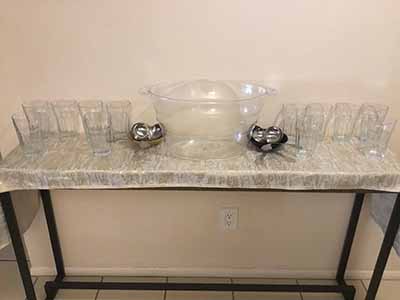 empty punch bowel and glasses