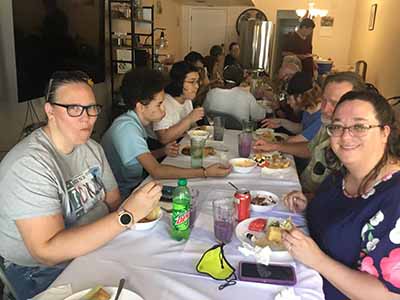 people at potluck dinner