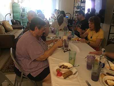 people at potluck dinner