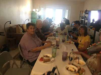people at potluck dinner