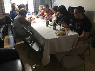people at potluck dinner