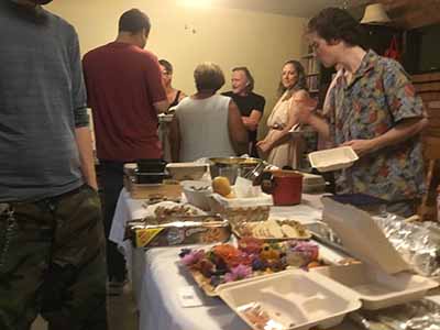 people at potluck dinner