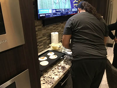 David making pancakes on griddle