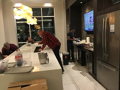Phil and Sam cleaning up after event