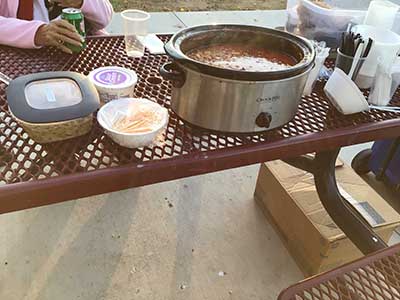 chili with sour cream and cheese toppings