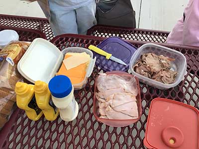sandwich fixings with deli meats and cheese