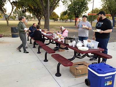 people at potluck dinner