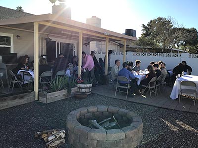people at Thanksgiving Day potluck dinner