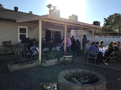 people at Thanksgiving Day potluck dinner