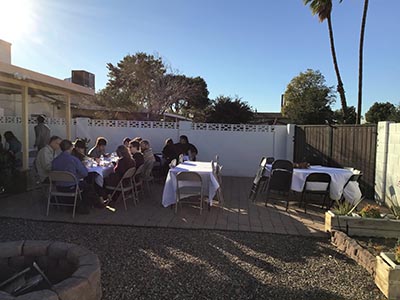 people at Thanksgiving Day potluck dinner