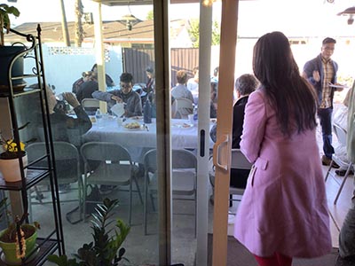 people at Thanksgiving Day potluck dinner
