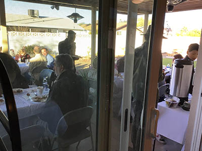people at Thanksgiving Day potluck dinner