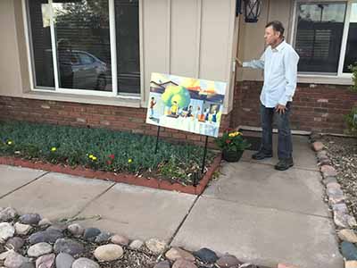 home exterior with potluck poster