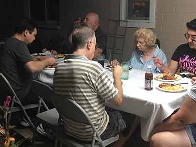people at potluck dinner