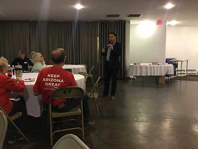 Republican candidate Kelly Cooper speaking to neighbors