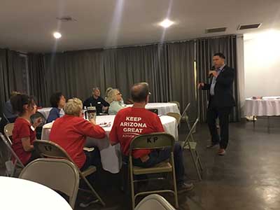 Republican candidate Kelly Cooper speaking to neighbors