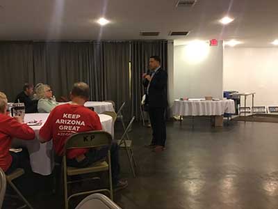 Republican candidate Kelly Cooper speaking to neighbors