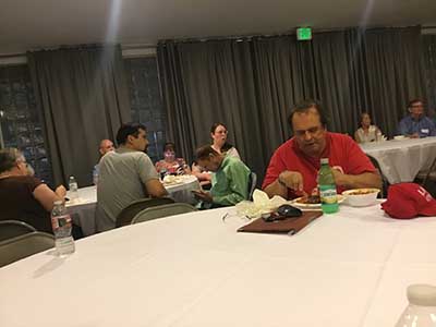 people at potluck dinner