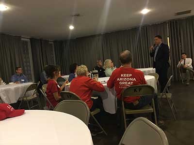 Republican candidate Kelly Cooper speaking to neighbors
