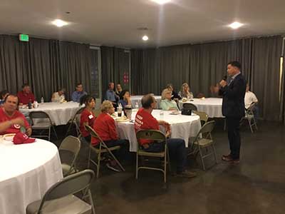 Kelly Cooper speaking to neighbors