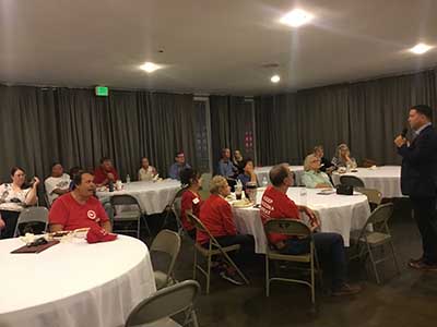 Republican candidate Kelly Cooper speaking to neighbors
