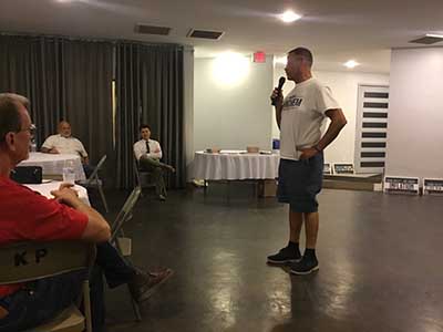 Republican candidate Mark Finchem speaking to neighbors