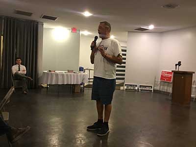 Republican candidate Mark Finchem speaking to neighbors