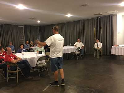 Republican candidate Mark Finchem speaking to neighbors