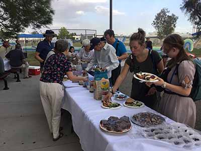 people at potluck dinner