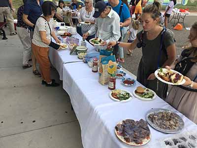 people at potluck dinner