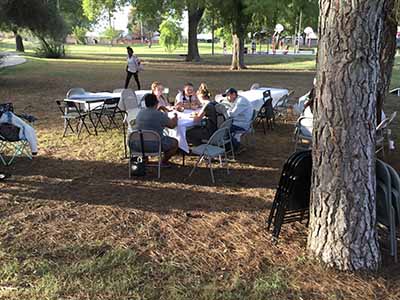 people at potluck dinner