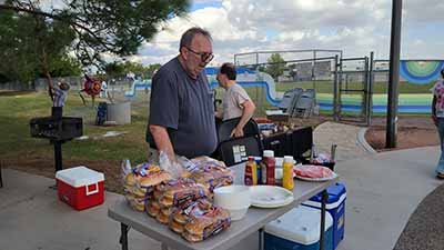 Don Till preparing burgers