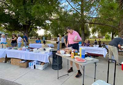 people at potluck dinner