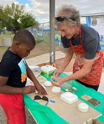 artist showing art to child