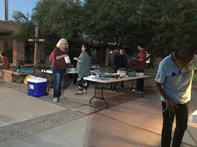 people at potluck dinner