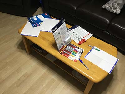 Forward Party literature and nametags on entrance table