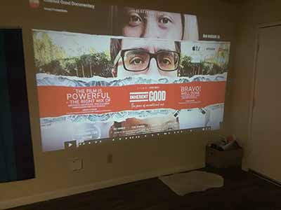 Inherent Good movie poster projected onto wall