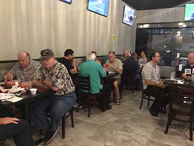 Men gathered for Guys Night Out event at Foreva Wings restaurant