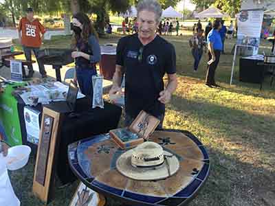artist with table he made