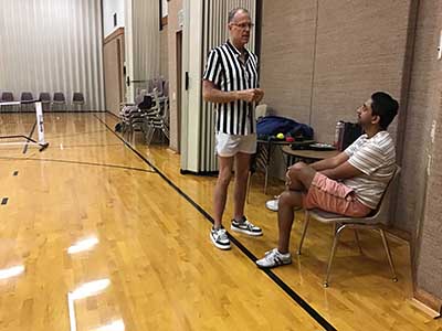 neighbors playing pickleball