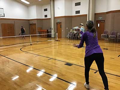 neighbors playing pickleball