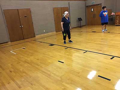 neighbors playing pickleball